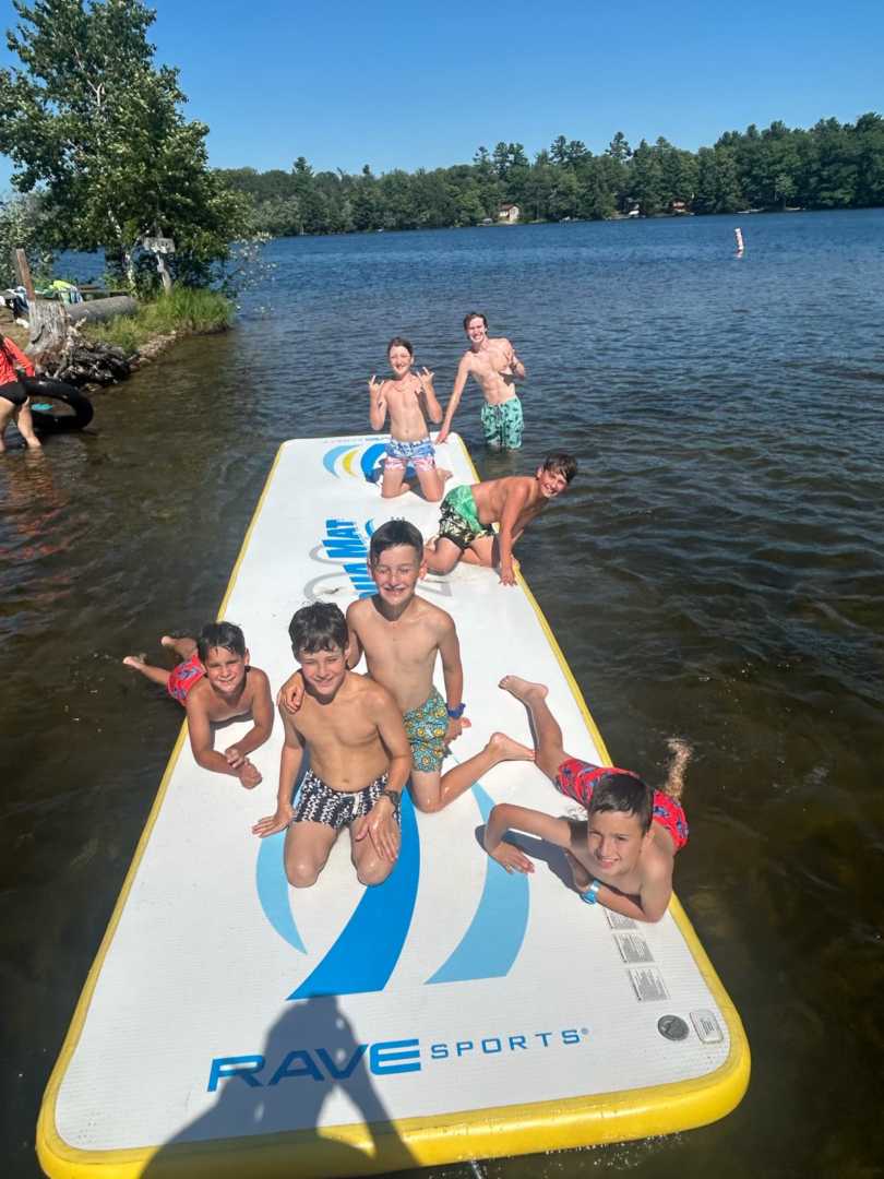 Campers swimming and cooling off at the North Star waterfront on Spider Lake