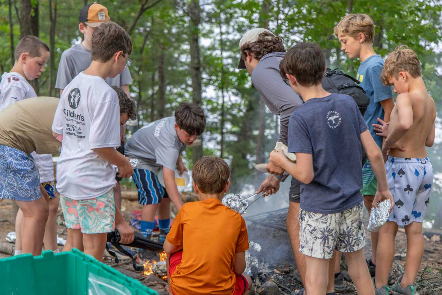 Campers gather around a cabin cookout on Cruiser Day at North Star.