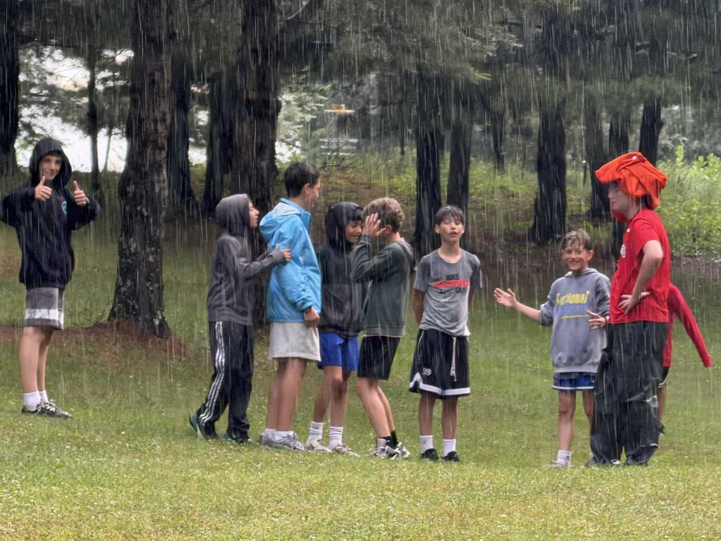 Boys taking part in a group activity together at summer camp