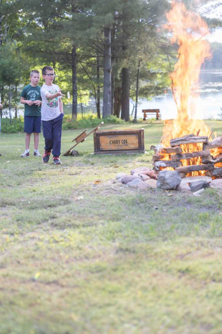 A North Star camper speaks during the Keylog Ceremony around the campfire