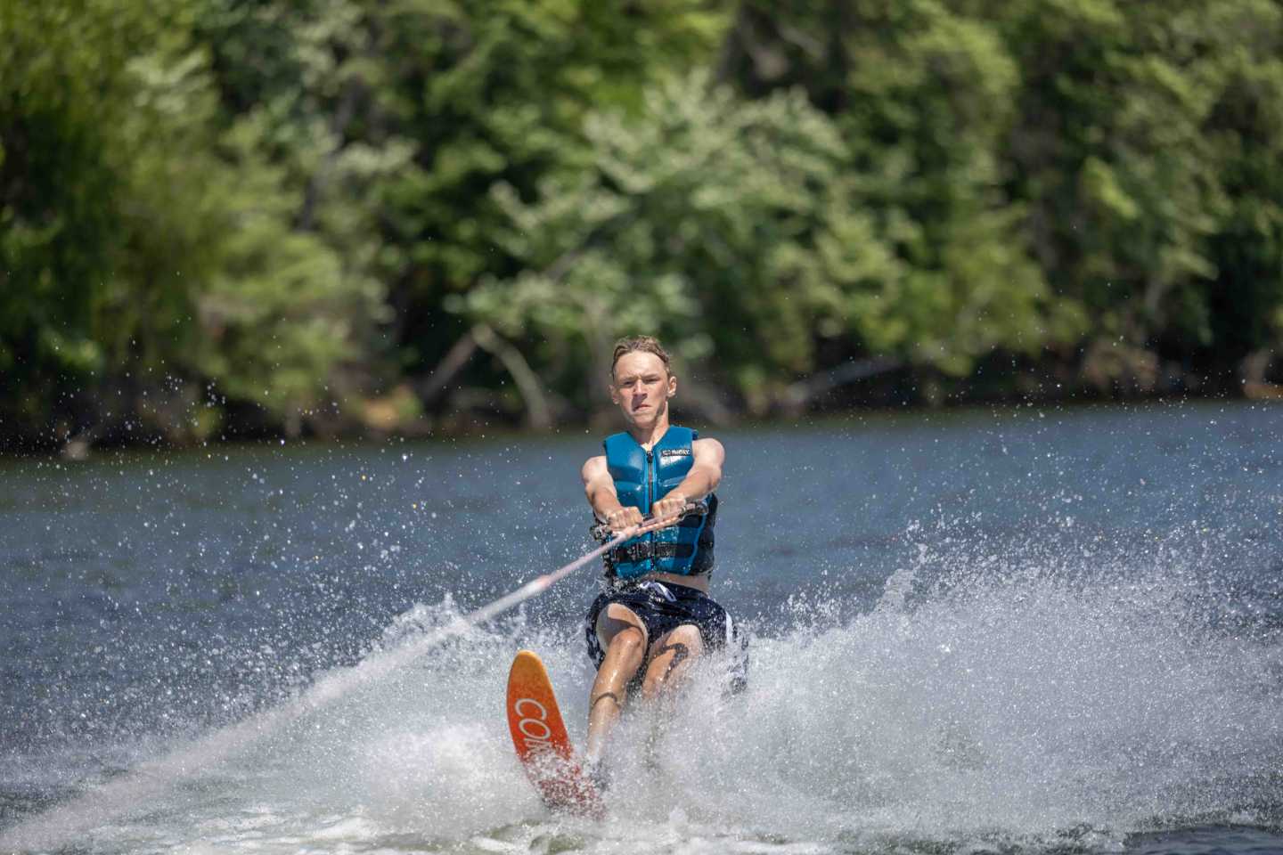A camper waterskis on the lake during a Wisconsin summer afternoon