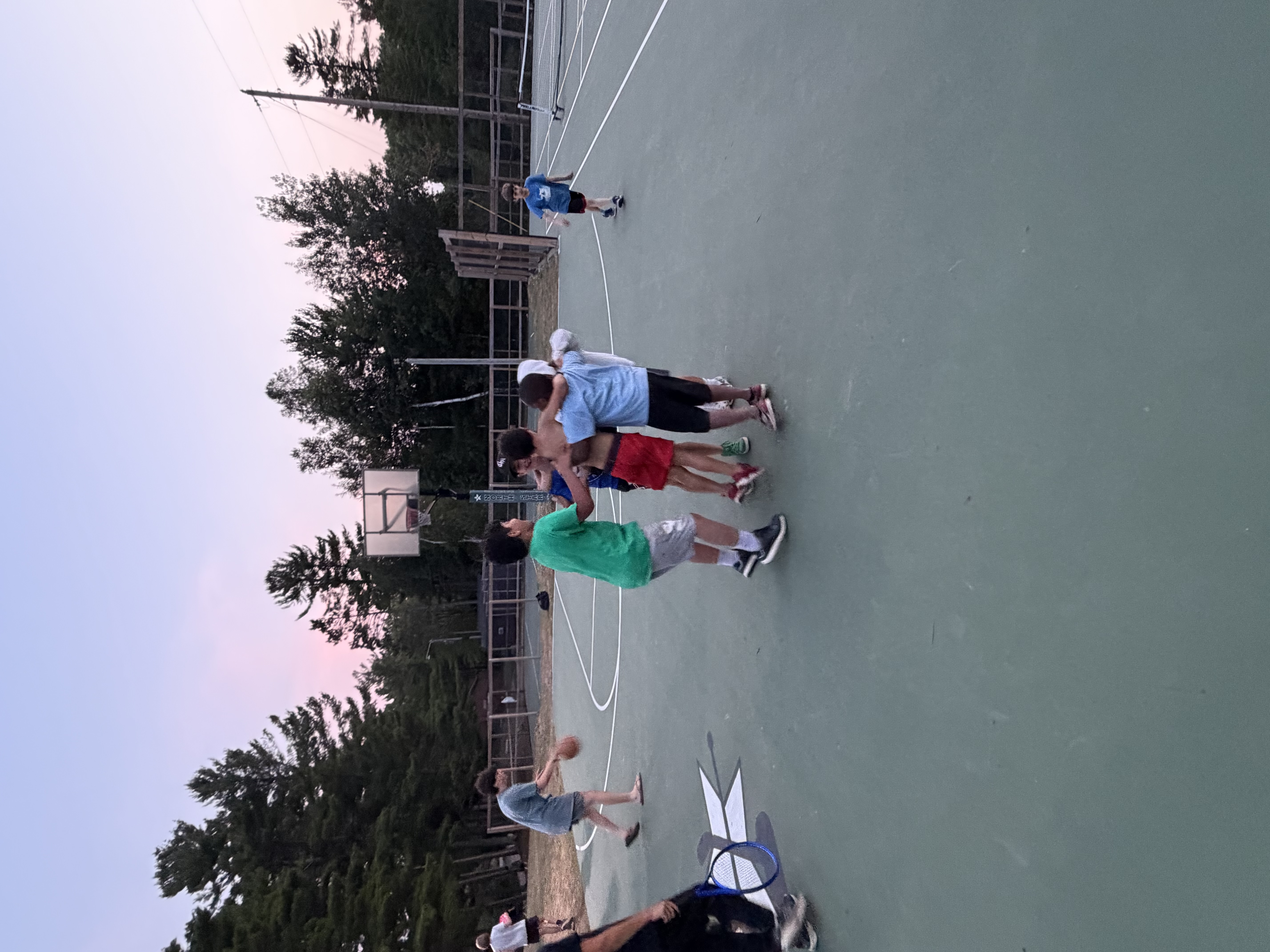 A camper and the director face off on the basketball court at North Star