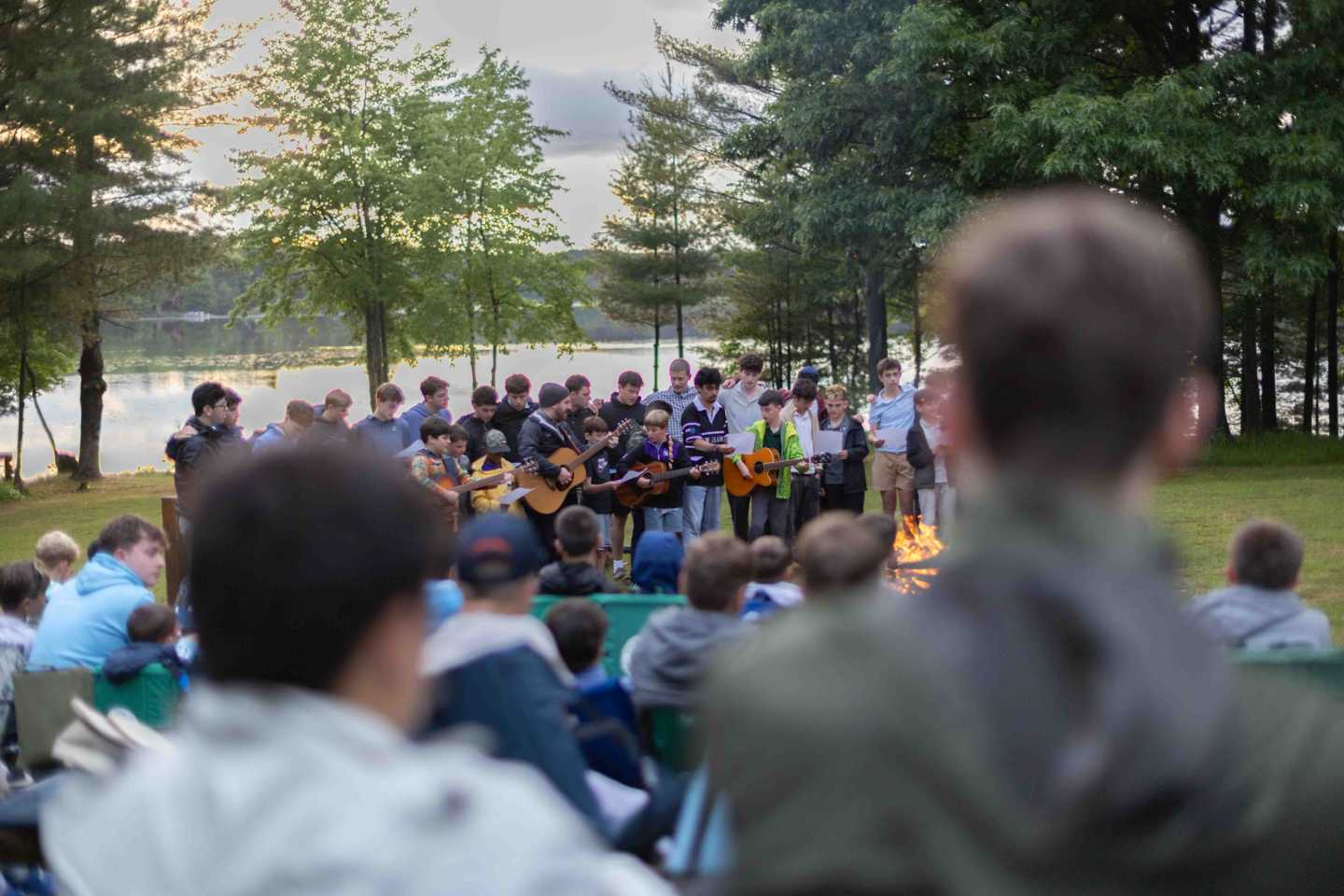 The camp chorus performing songs about friendship at the Council Ring