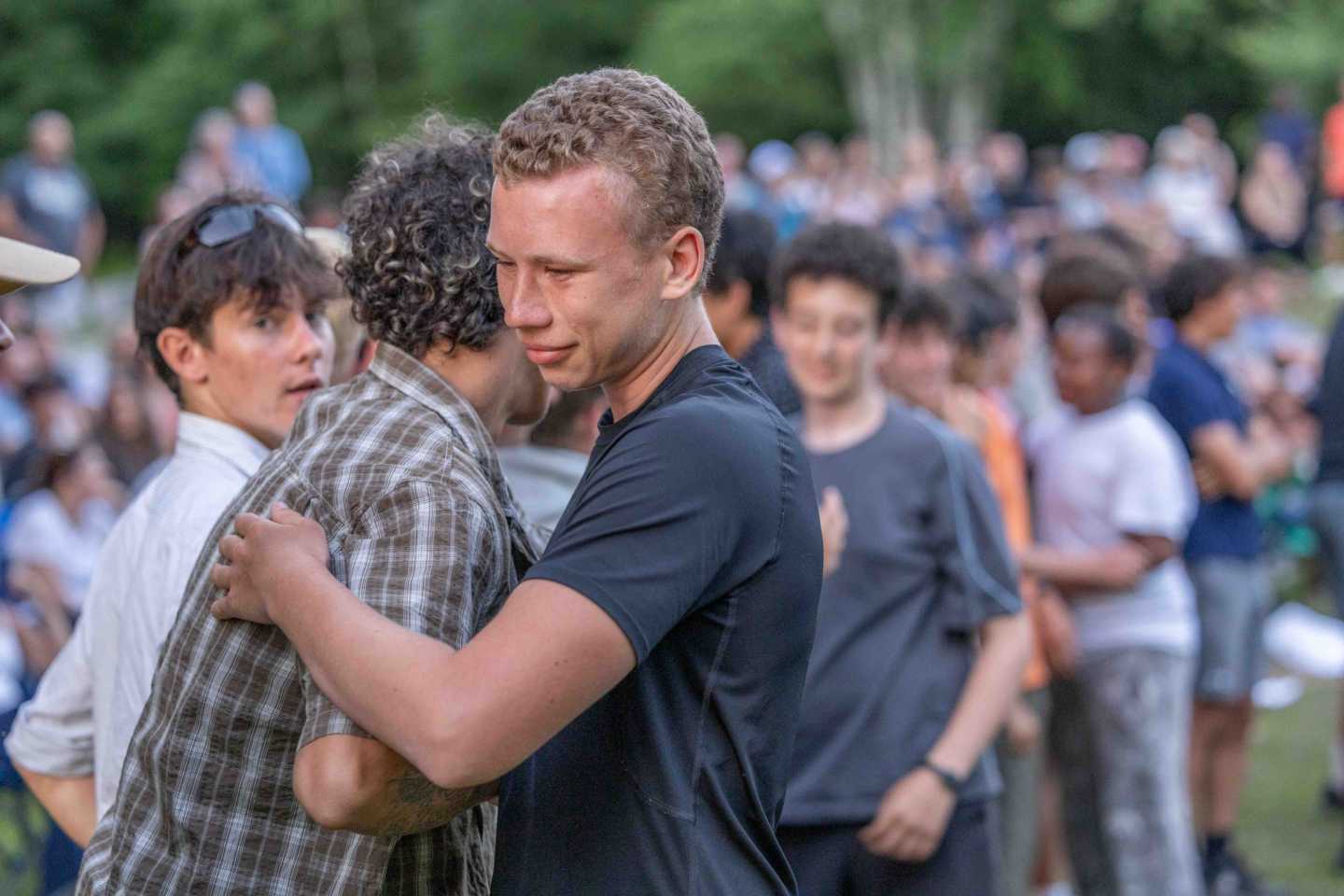 Campers share hugs after the Keylog Ceremony at North Star