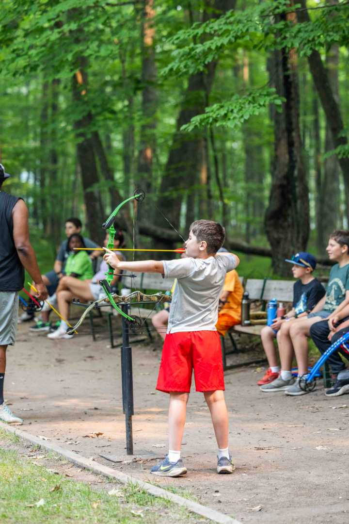 A North Star camper at the archery range