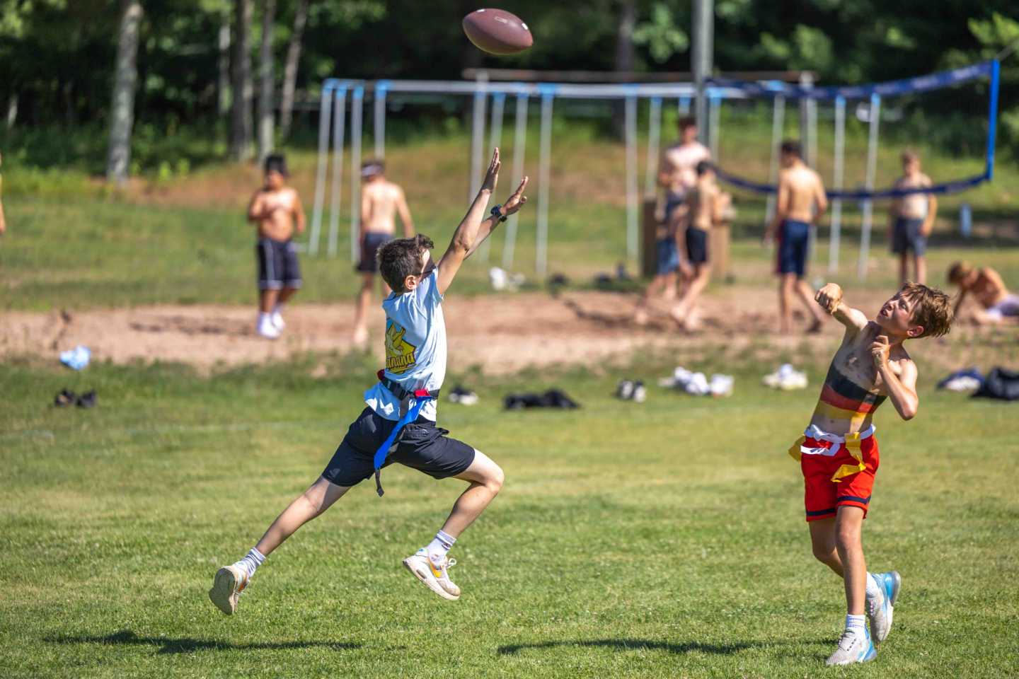 A camper competes in a field event during United Nations Day at a Wisconsin boys summer camp