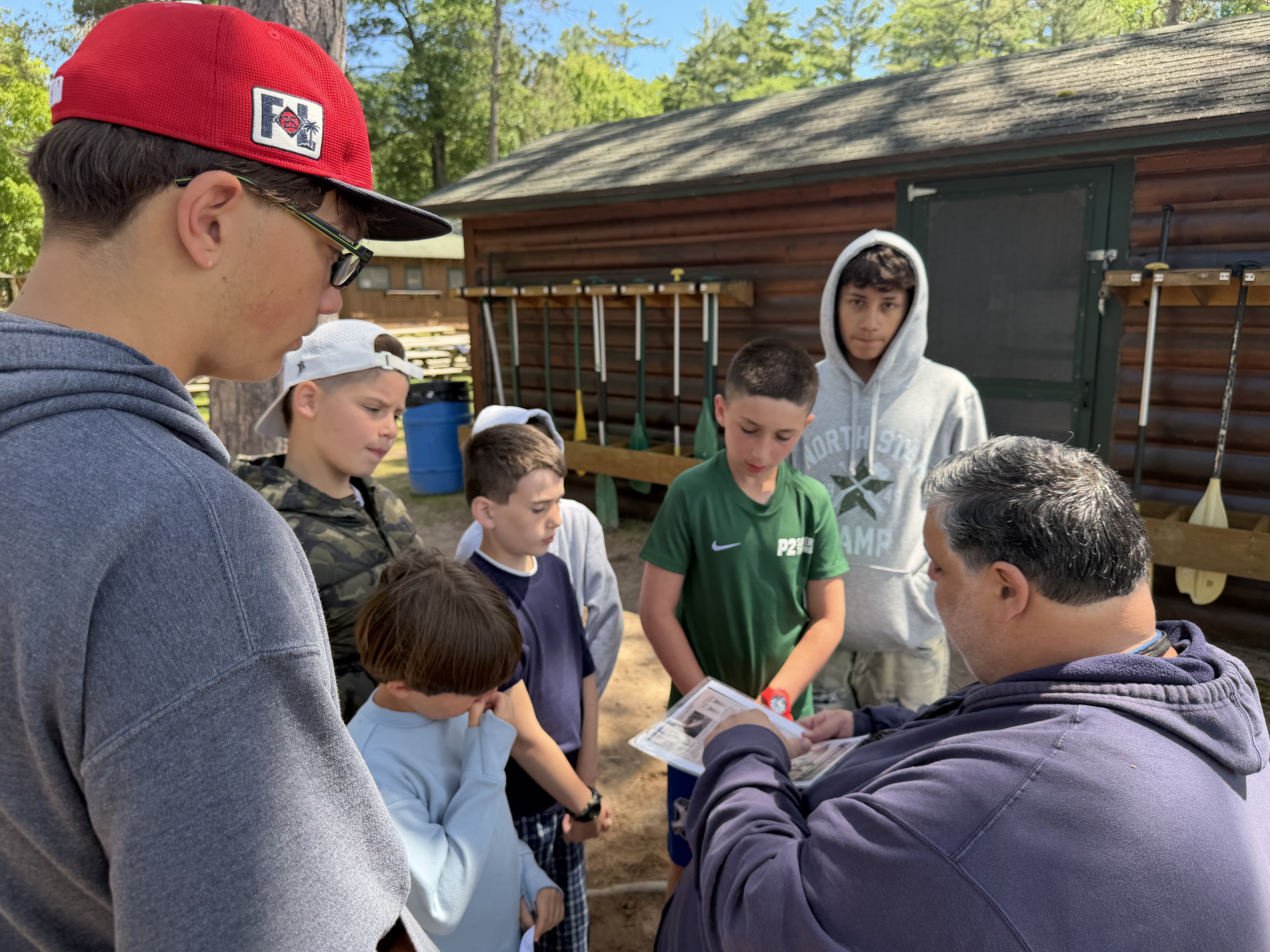 Campers taking part in waterfront and outdoor activities at summer camp